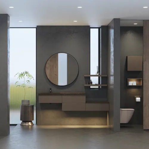 Stilrent och rymligt badrumsinspiration med stor rund spegel med svart ram, mörk stenhandsfat, färgad toalett, överskåp och öppen hylla i en sofistikerad och dämpad design