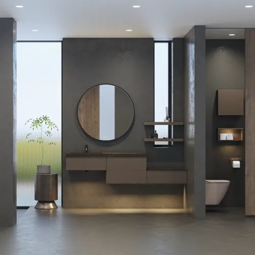 Stilrent och rymligt badrumsinspiration med stor rund spegel med svart ram, mörk stenhandsfat, färgad toalett, överskåp och öppen hylla i en sofistikerad och dämpad design