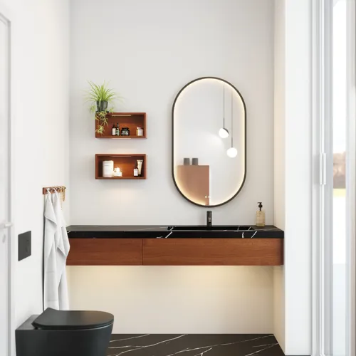 Modern och stilren badrumsinspiration med oval spegel med svart ram och ljusreglering, färgad toalett, tvättställsskåp, underskåp och skåp i rödbrun ek, Silestone handfat och matchande golv