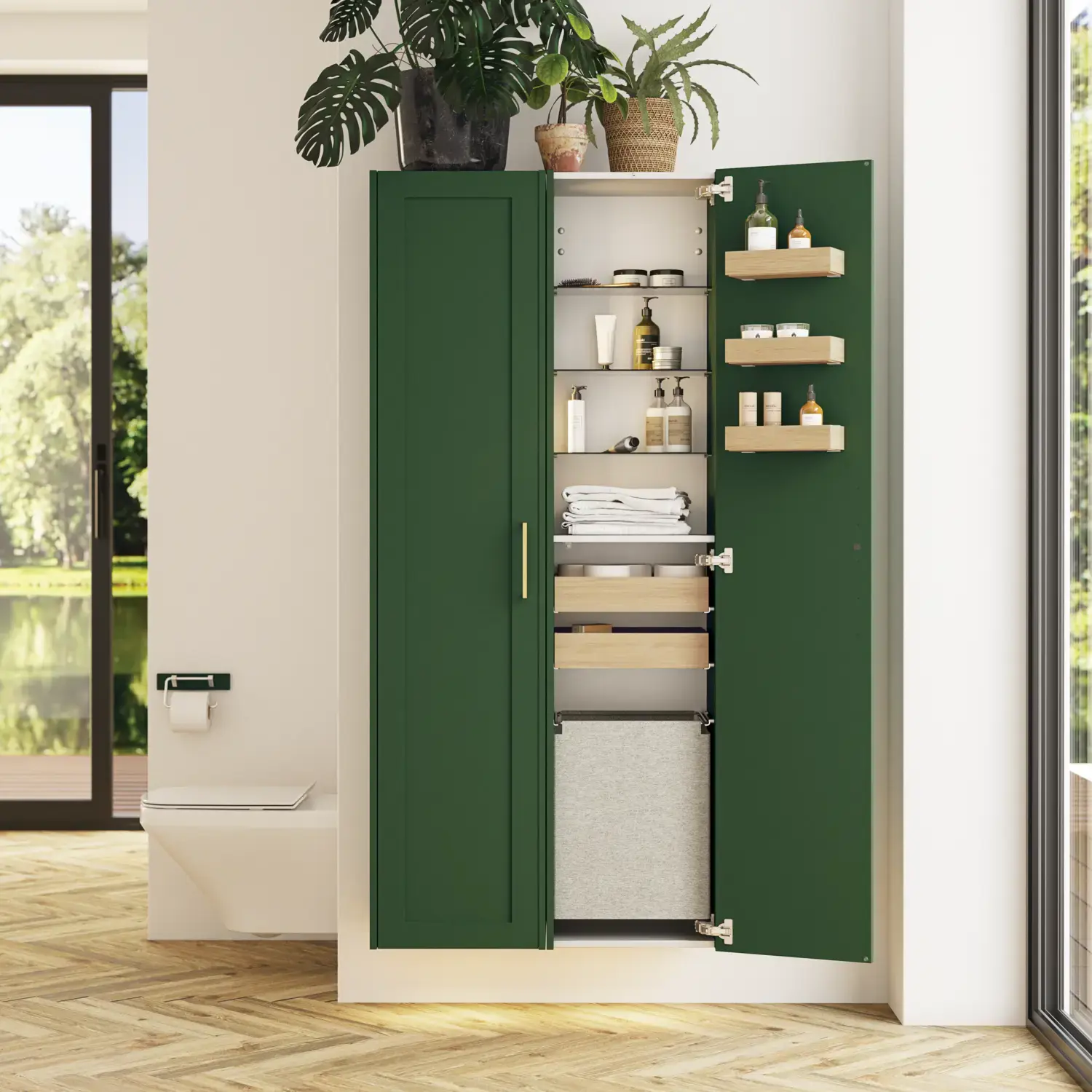 Stort badrum i gröna färger med tvättställsskåp, oval spegel med guldkant och vackra luckor med ram