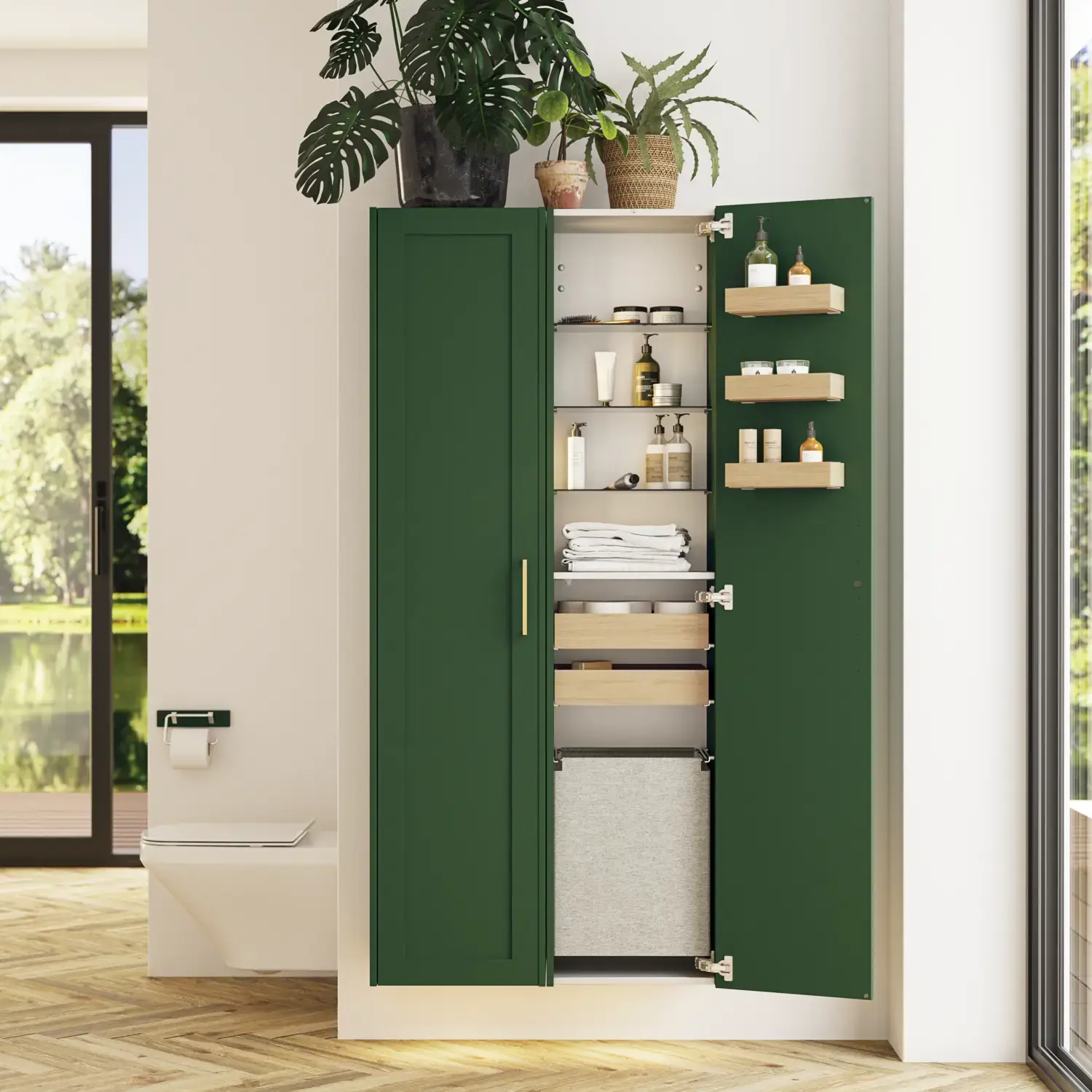 Stort badrum i gröna färger med tvättställsskåp, oval spegel med guldkant och vackra luckor med ram