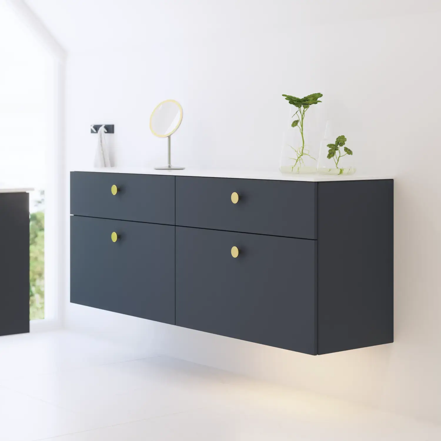 Elegant och modern badrumsinspiration med snedtak, väggmonterade blå tvättställsskåp och underskåp, rund handfat med mässingsarmatur, belyst spegel och naturligt ljusinsläpp