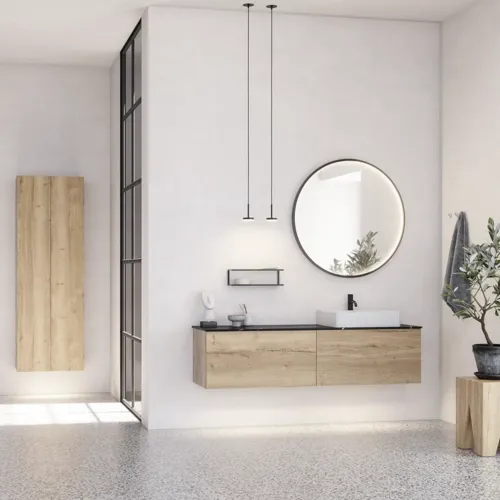 Stor urban badrumsinspiration med möbler i naturlig ek, stenbänkskiva med fyrkantig vask, runt spegel med svart kant, naturfärger och terrakottagolv ger en industriell och modern känsla