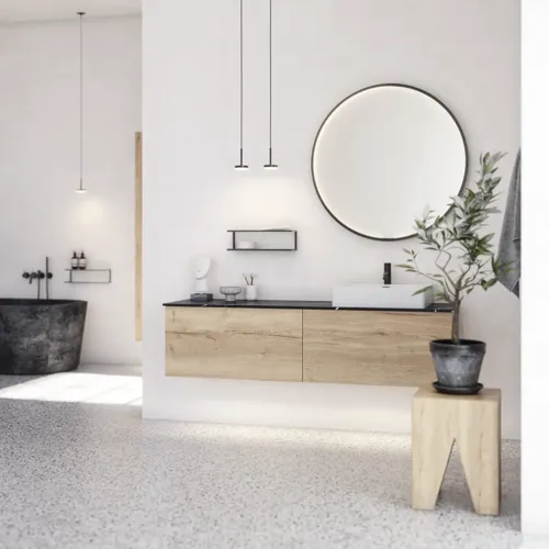Stor urban badrumsinspiration med möbler i naturlig ek, stenbänkskiva med fyrkantig vask, runt spegel med svart kant, naturfärger och terrakottagolv ger en industriell och modern känsla