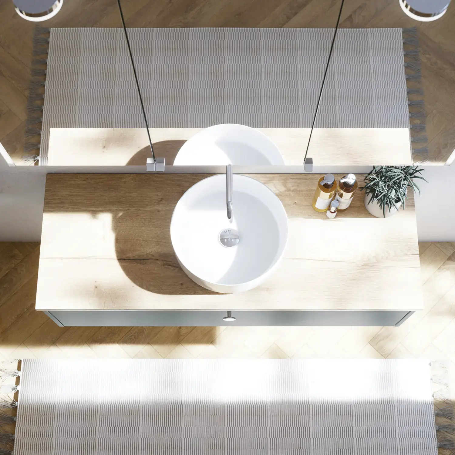 Stor badrumsinspiration i nordisk stil med badrumsmöbler i ljusblå färg och träbänkskiva med elegant fristående handfat, fiskbensgolv i trä som skapar en ljus och klassisk stil