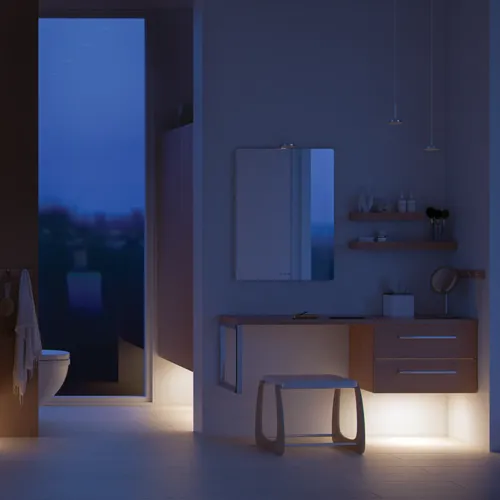 Modernt badrum i nordisk stil med ljust trä, elegant belysning, spegelskåpsvägg och stilfull inredning som skapar en varm och inbjudande atmosfär.