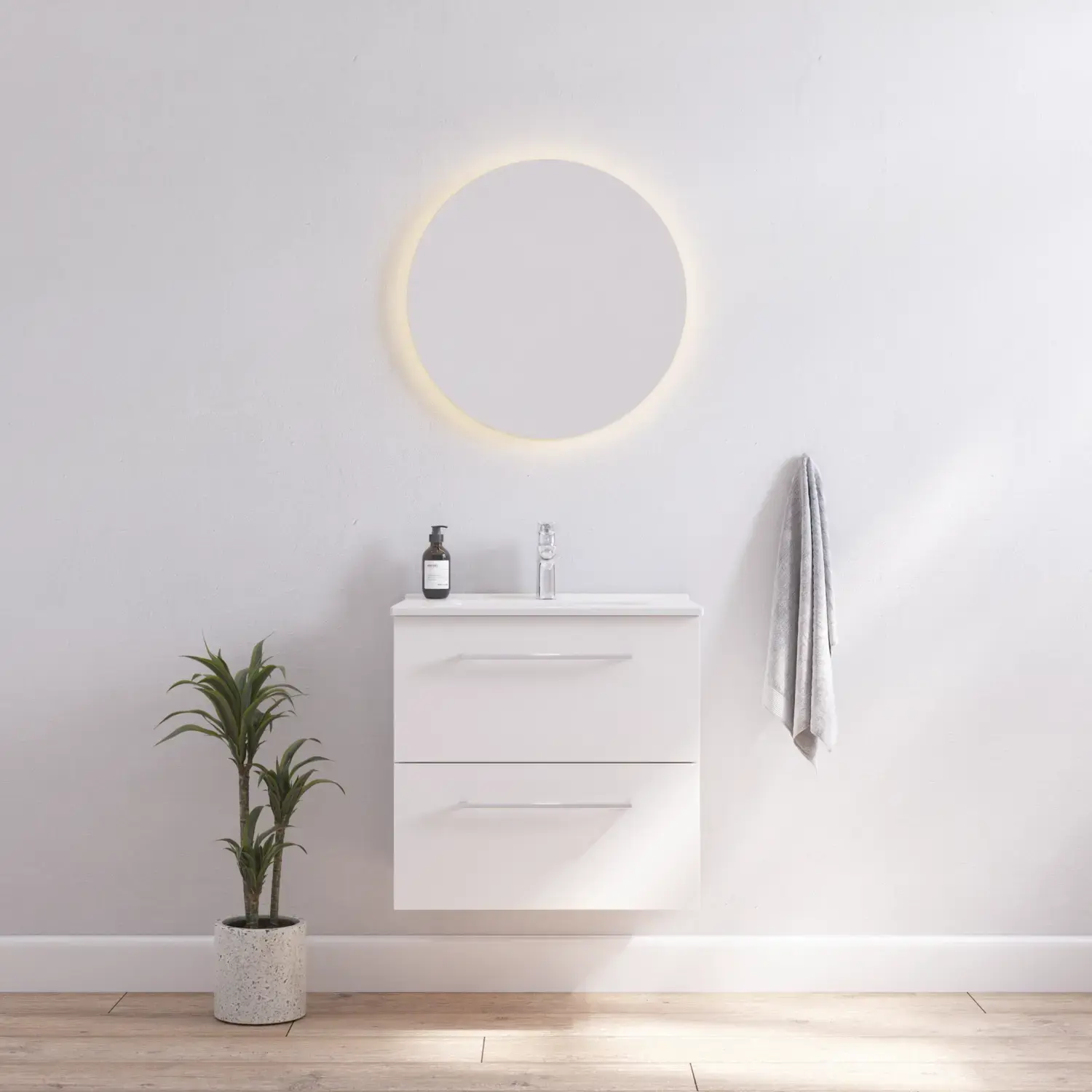 Badrumsinspiration med smal vit kommod med vita handtag och elegant tvättställ med vacker rund spegel med ljusa, vita väggar och trägolv för en ljus och minimalistisk look.